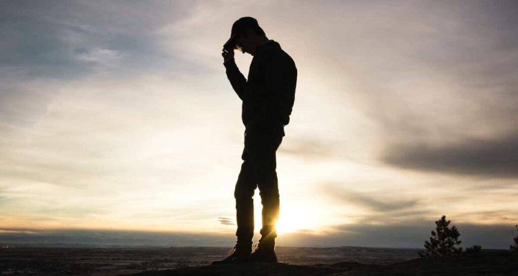 steps-fail-goals- silhouette of man holding cap