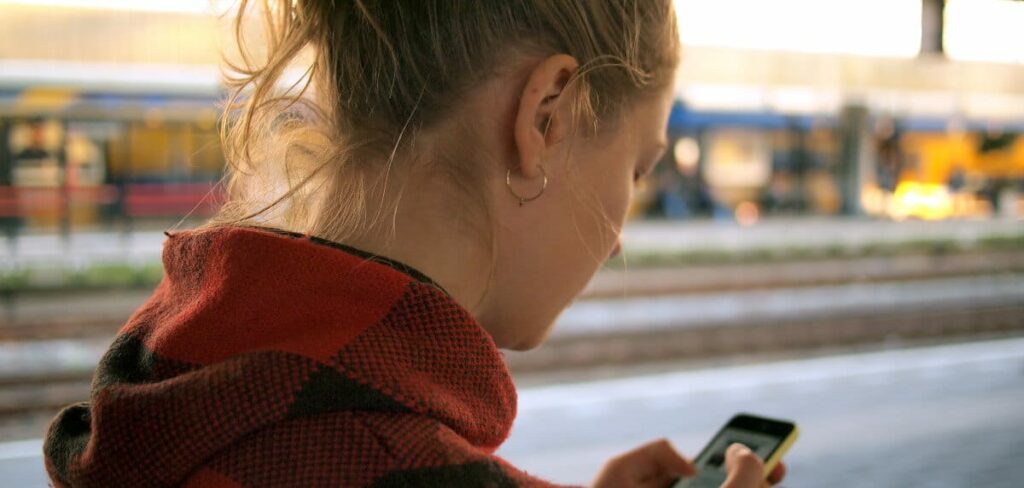 smart goals examples - woman looking at phone