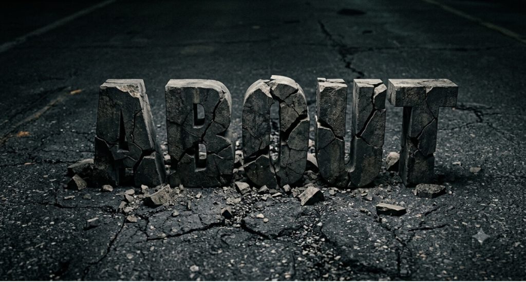 Cracked concrete with large 3D letters spelling 'ABOUT' on the ground.